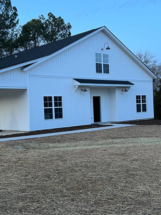 BKA Builders custom modern farmhouse with board-and-batten siding in Summerfield NC